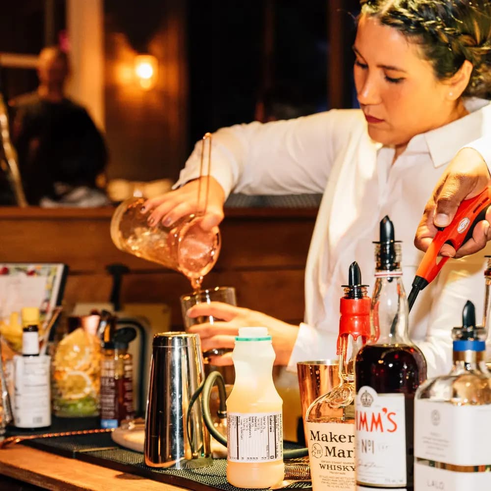 Bartender pouring champagne